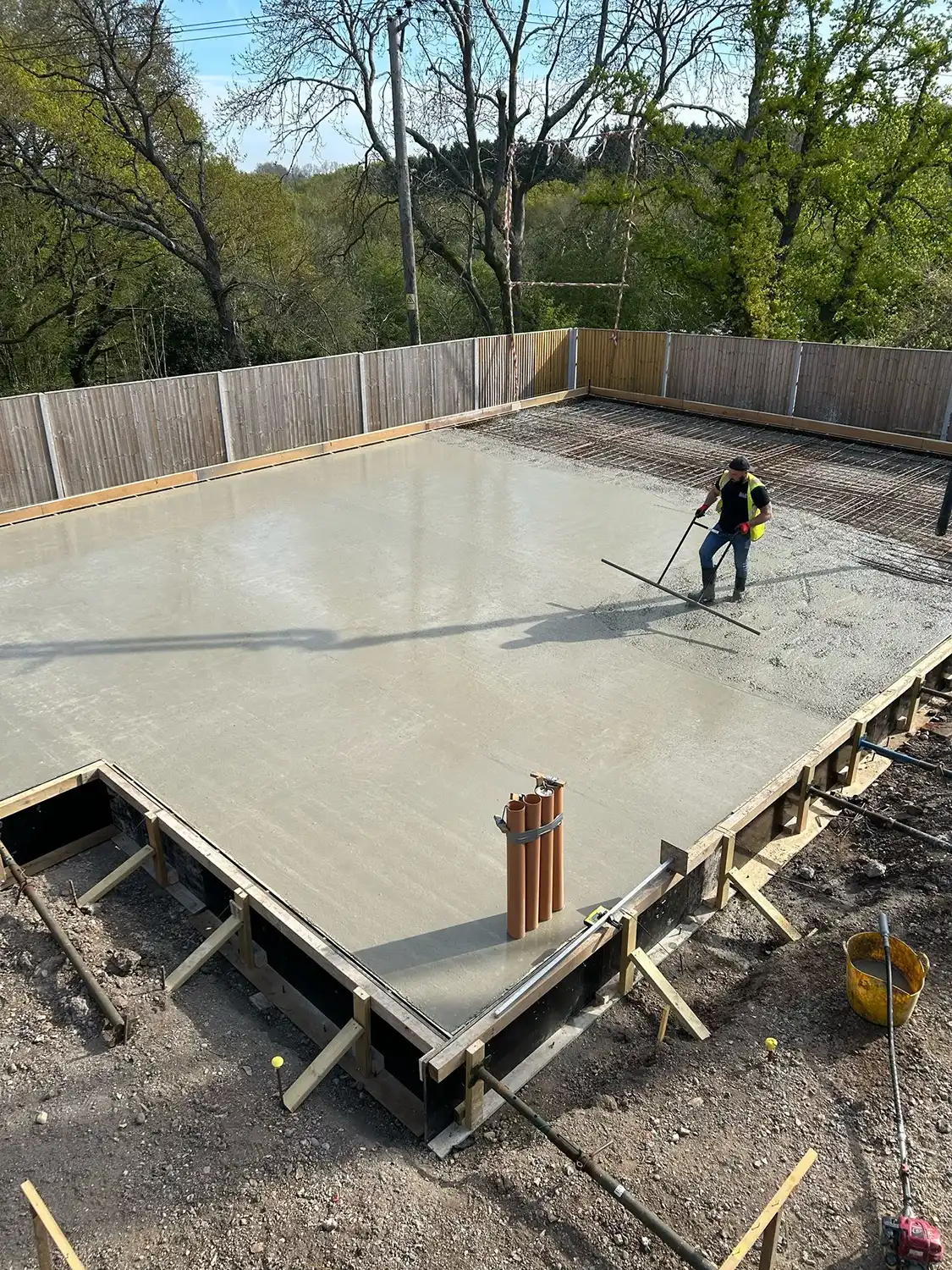 A man standing on top of a cement slab.