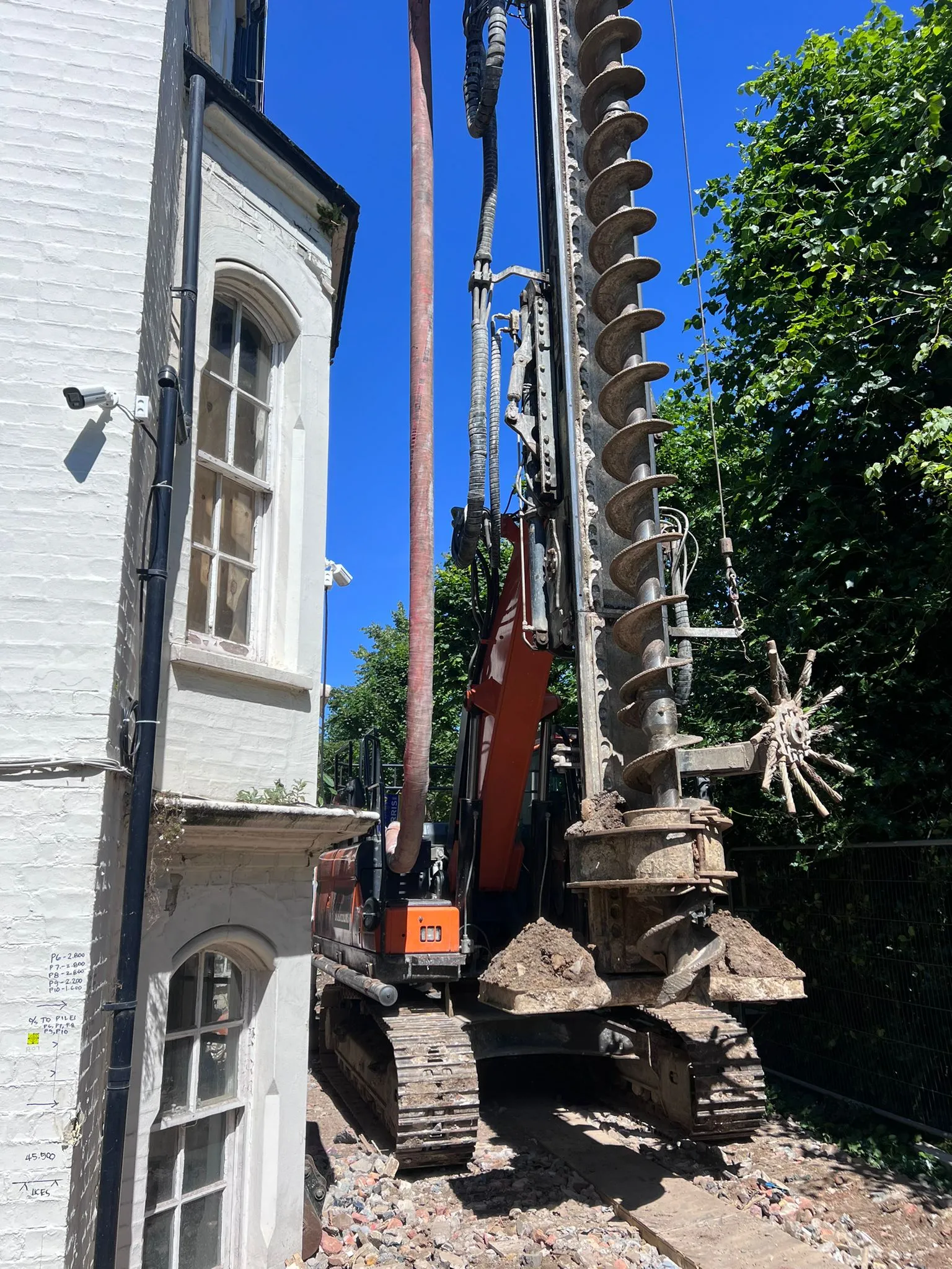 A large crane sitting on top of a pile of rubble.