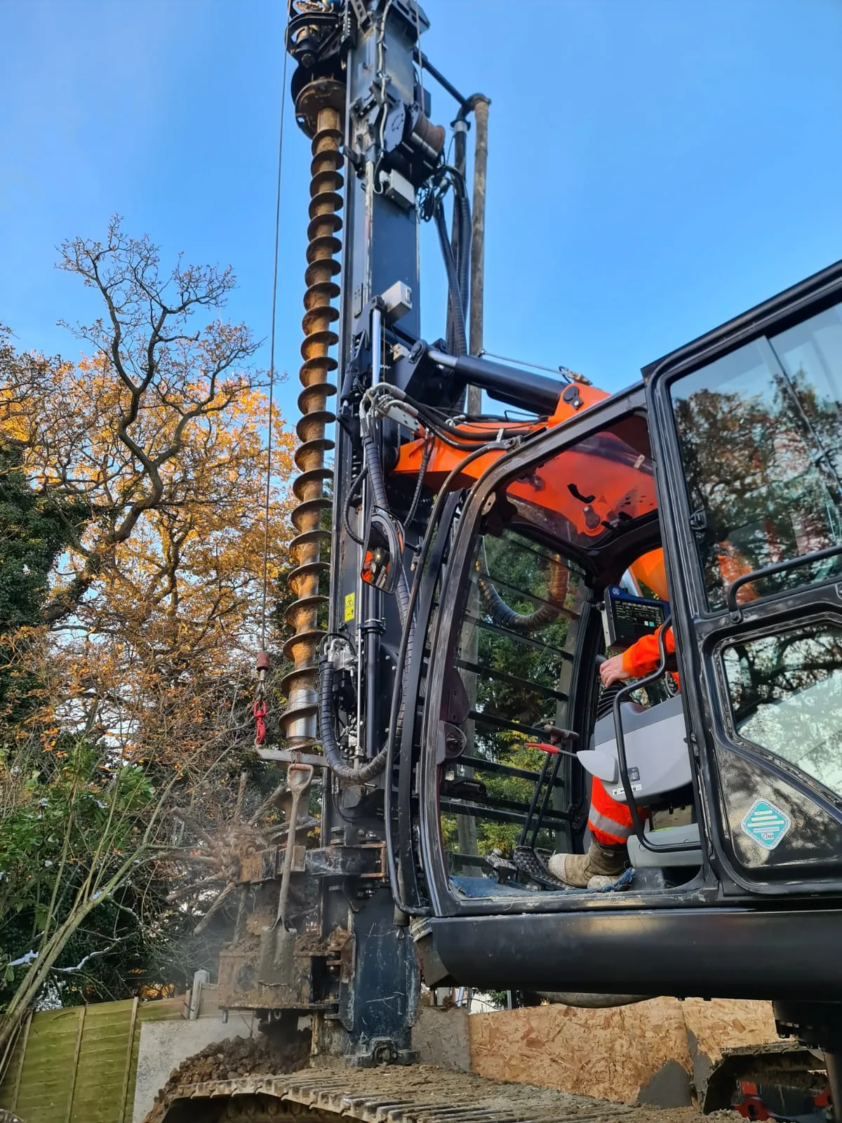 A large machine that is sitting in the dirt.