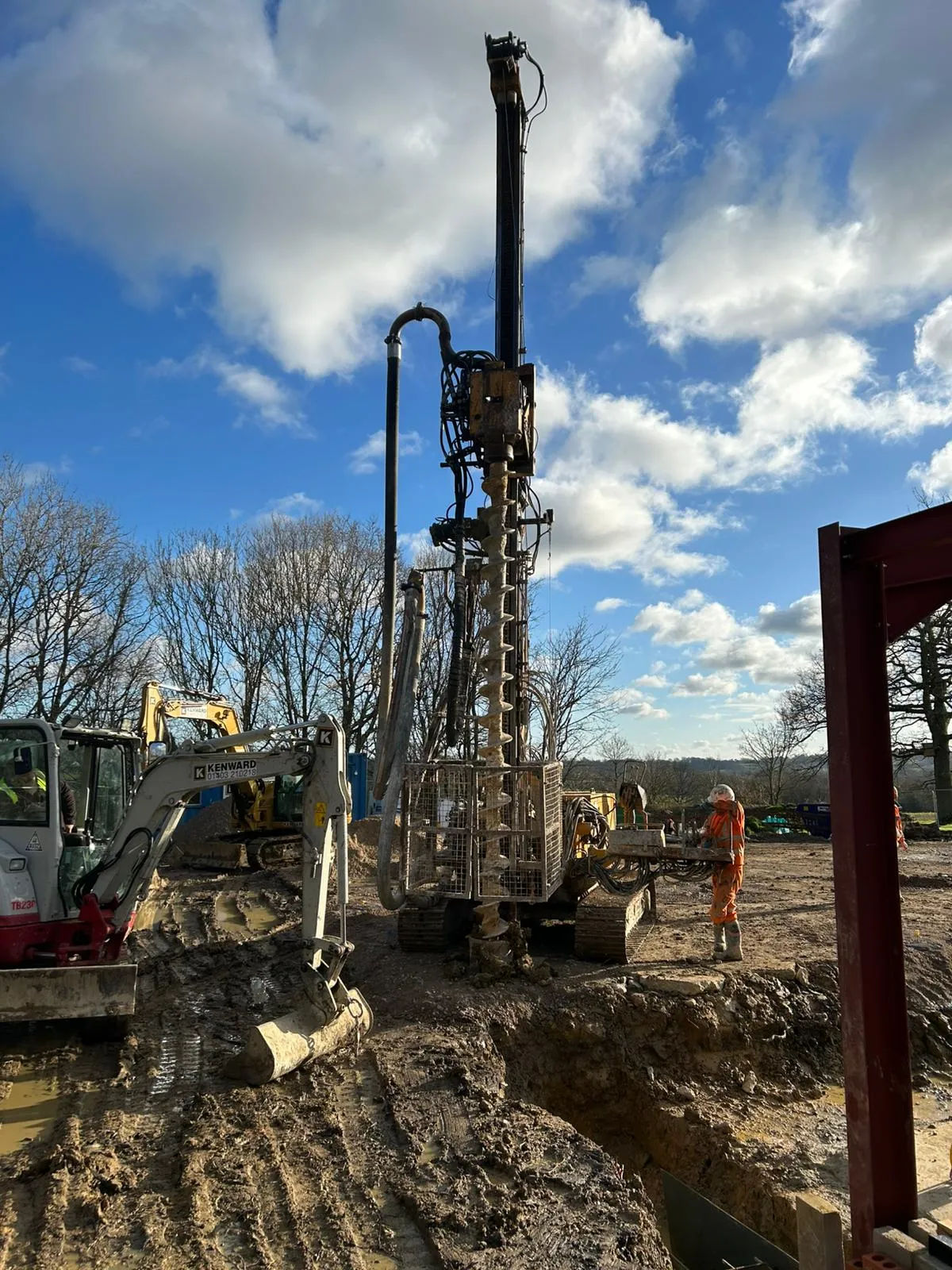 A group of men standing around a construction site.