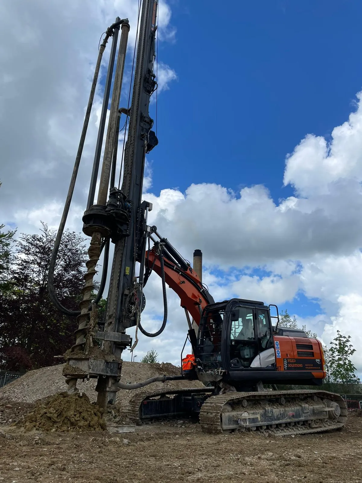 A large machine that is sitting in the dirt.